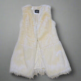 White fur vest on a tiled floor