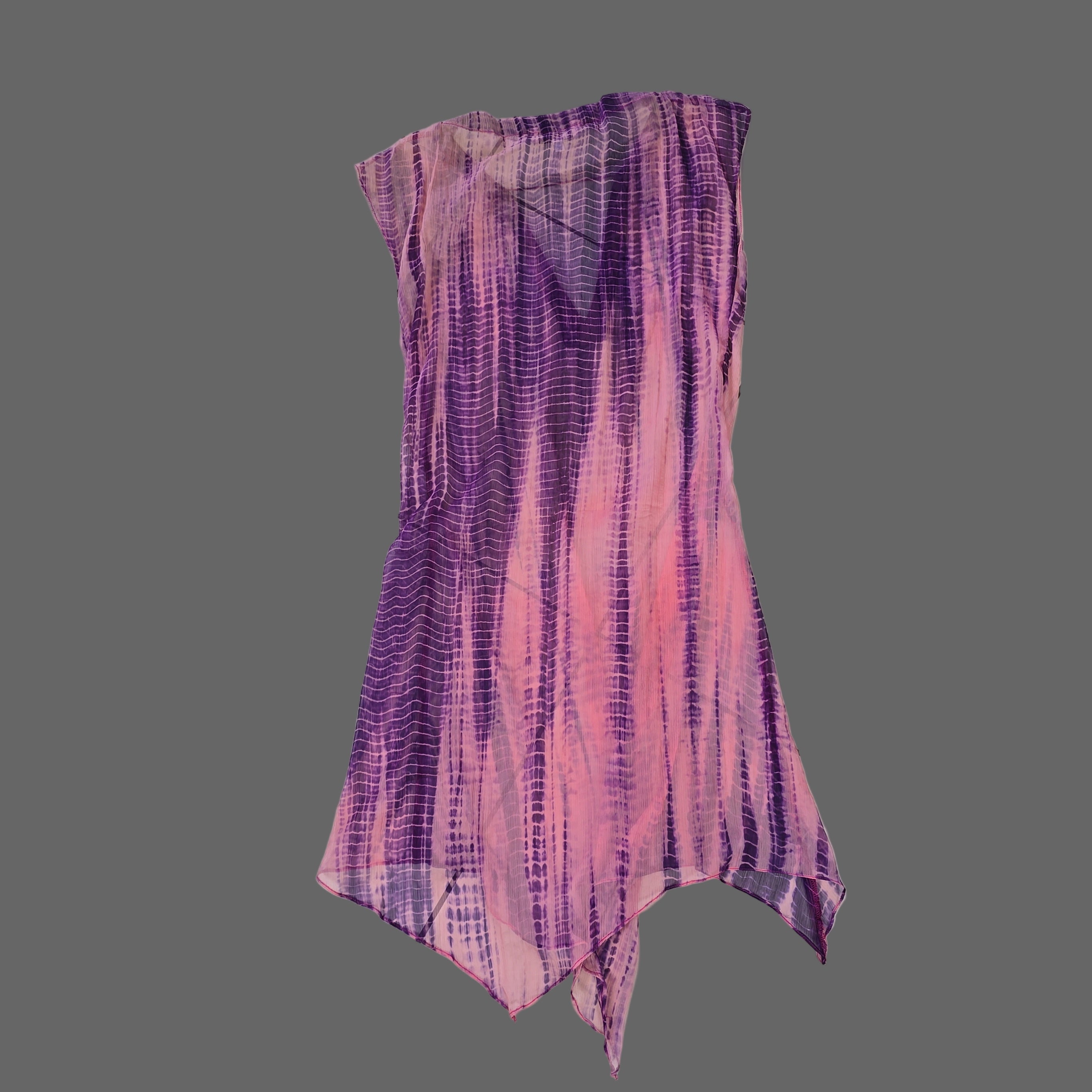 Purple and pink kaftan on a tiled floor