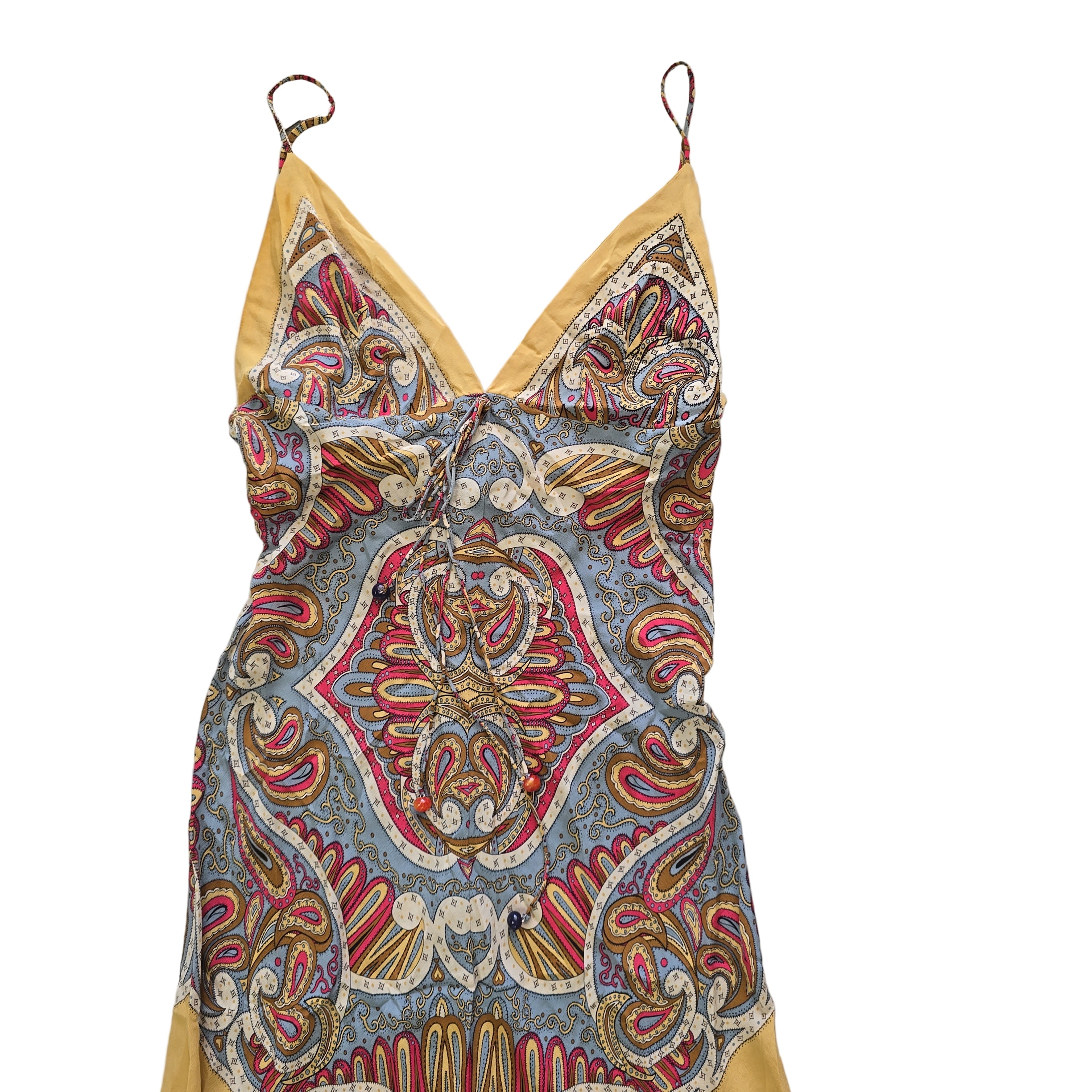 Decorative dress with paisley pattern on a tiled floor