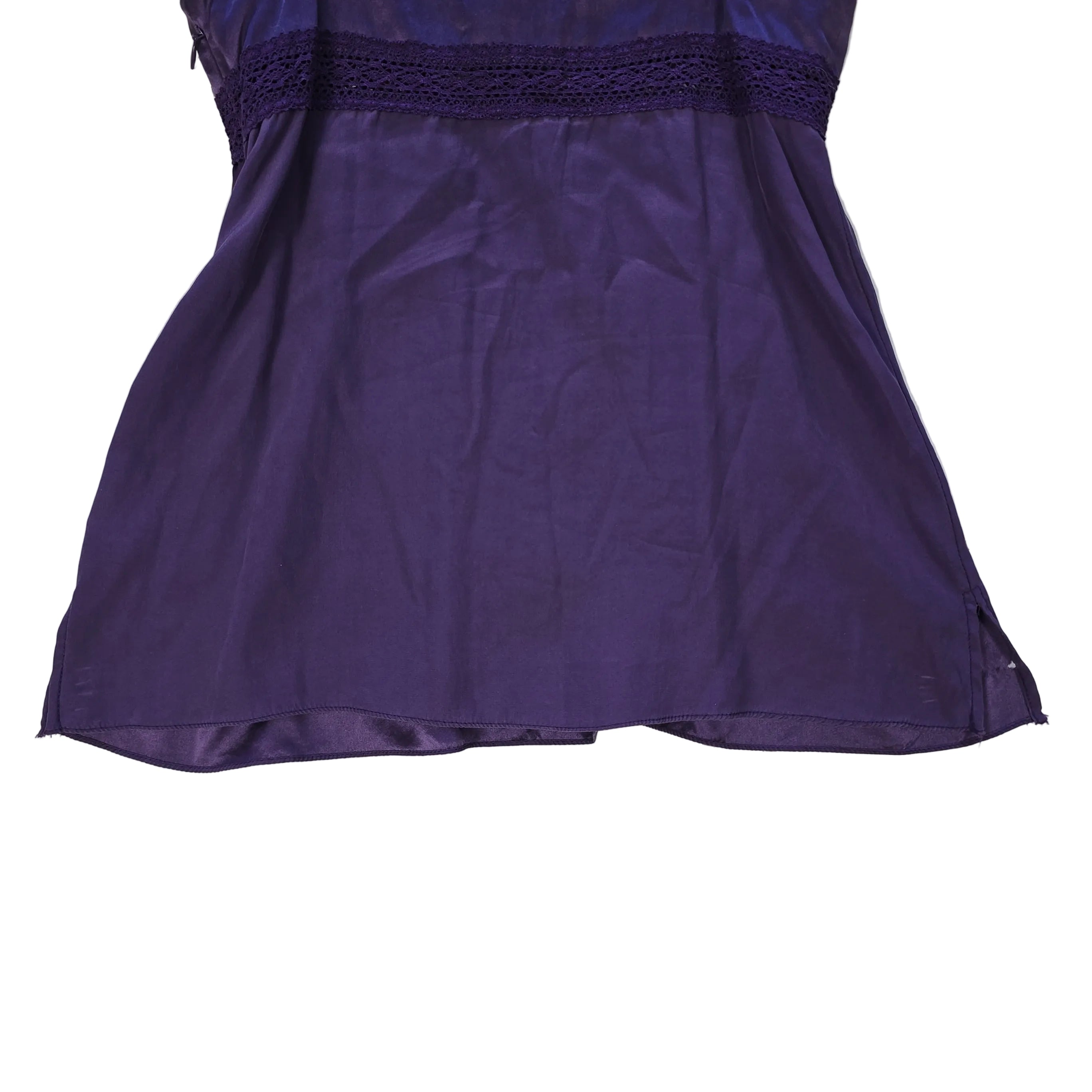 Purple lace-trimmed top on a light background