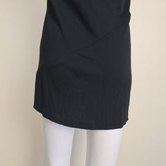 Black skirt on a mannequin against a beige background