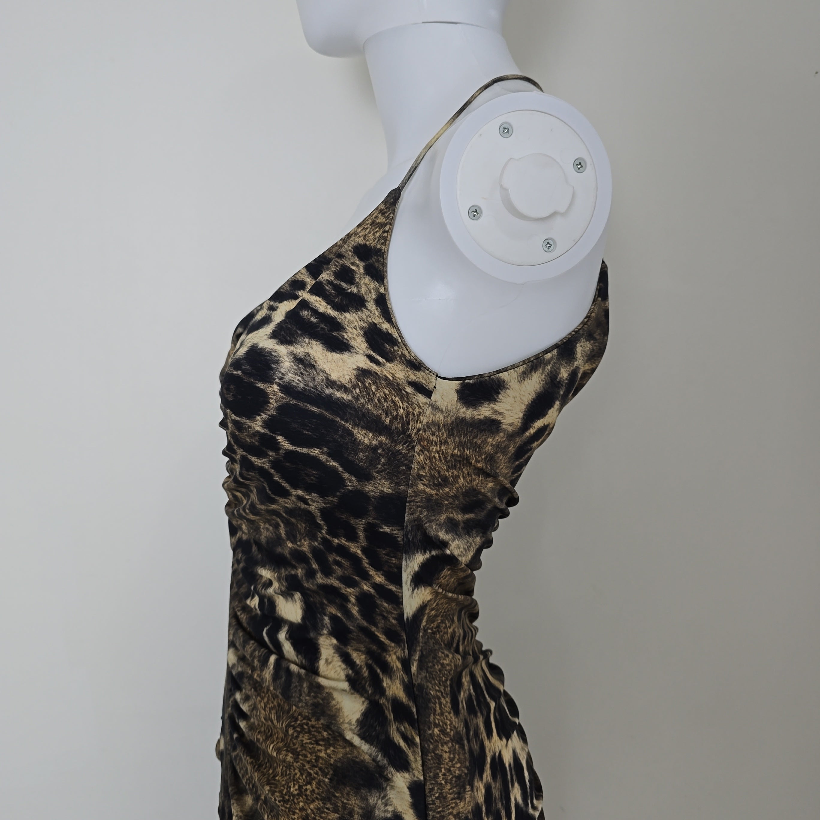 Leopard print dress on a mannequin arm with a white background