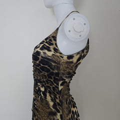 Leopard print dress on a mannequin arm with a white background