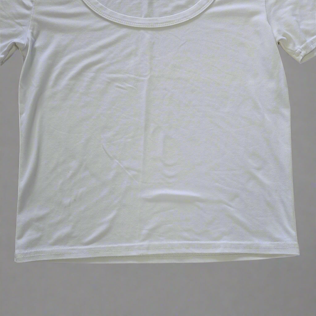 White t-shirt on a tiled floor