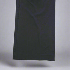 Black rectangular fabric on a tiled floor
