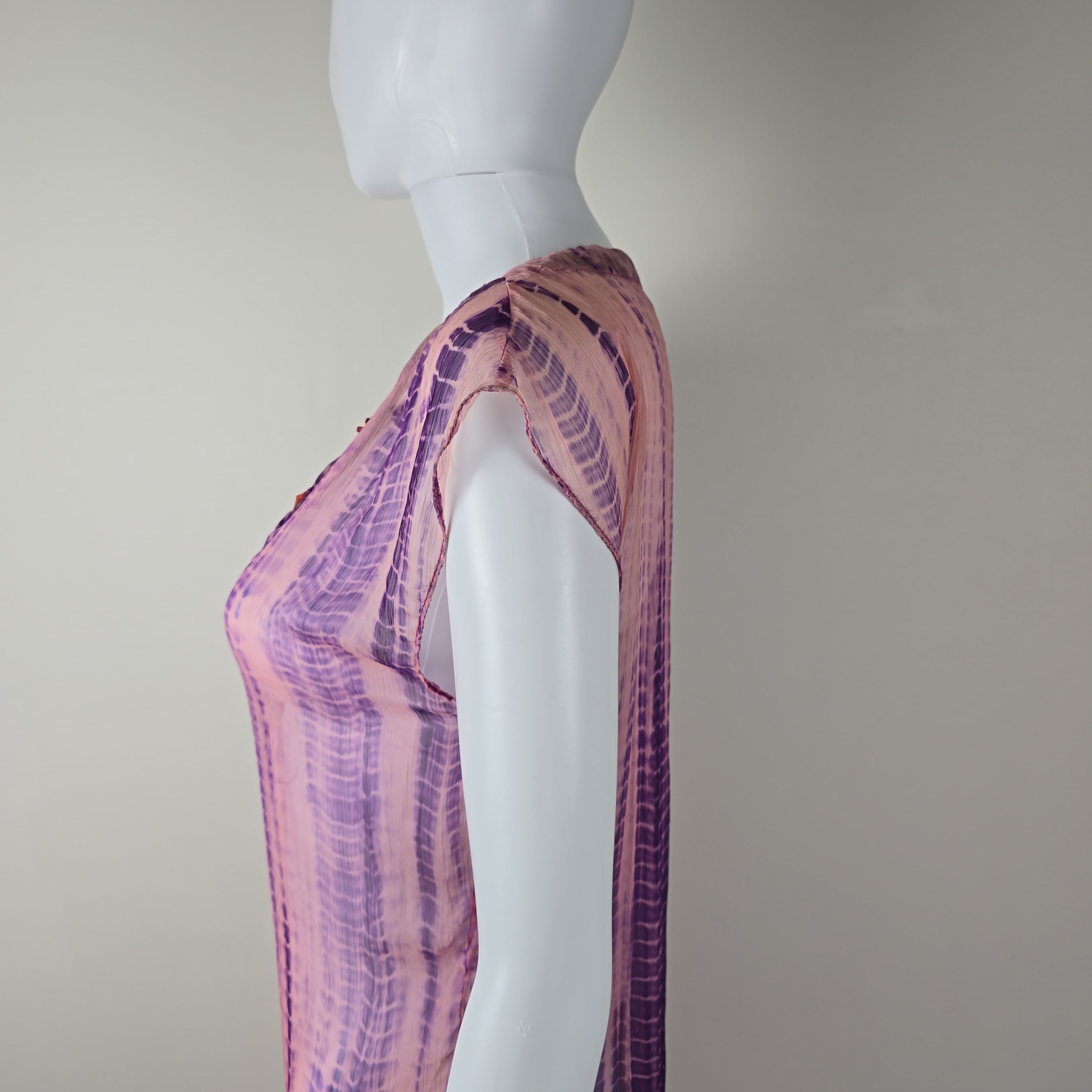 Purple and pink patterned fabric on a white background