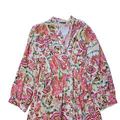 Floral patterned wrap style dress on a light background