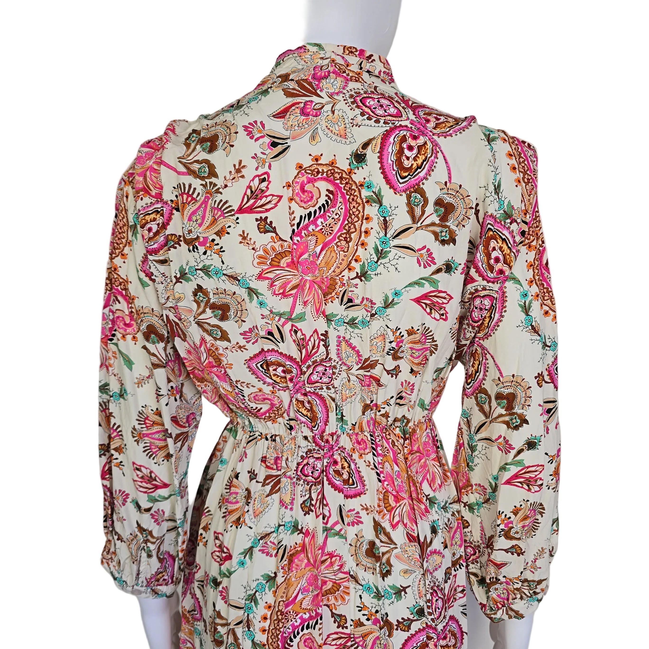 Floral and paisley patterned fabric on a white background