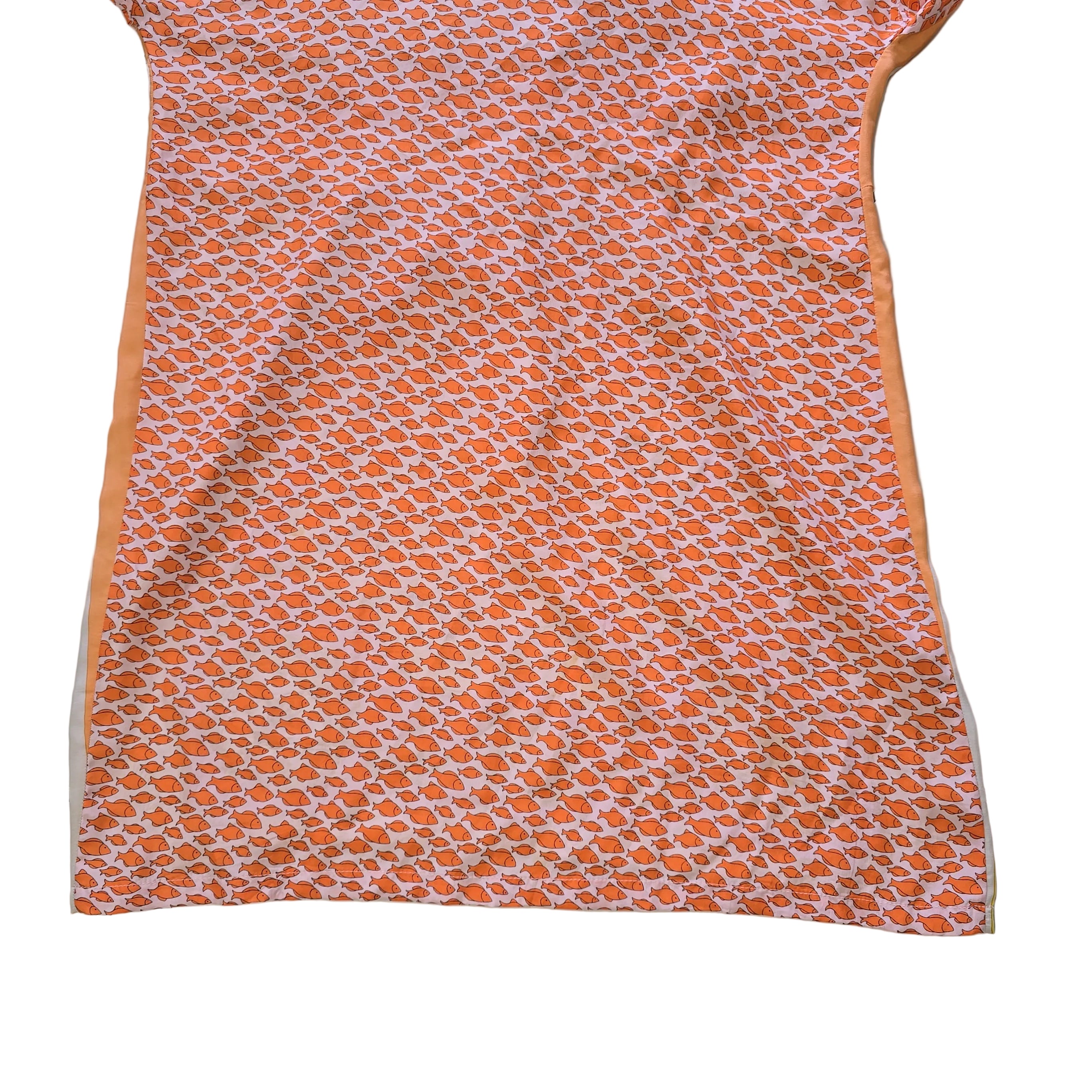 Decorative pink and yellow patterned fabric kaftan on a light background.