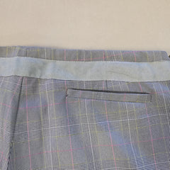 Plaid patterned fabric on a beige background