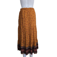 Brown patterned maxi skirt on a light background