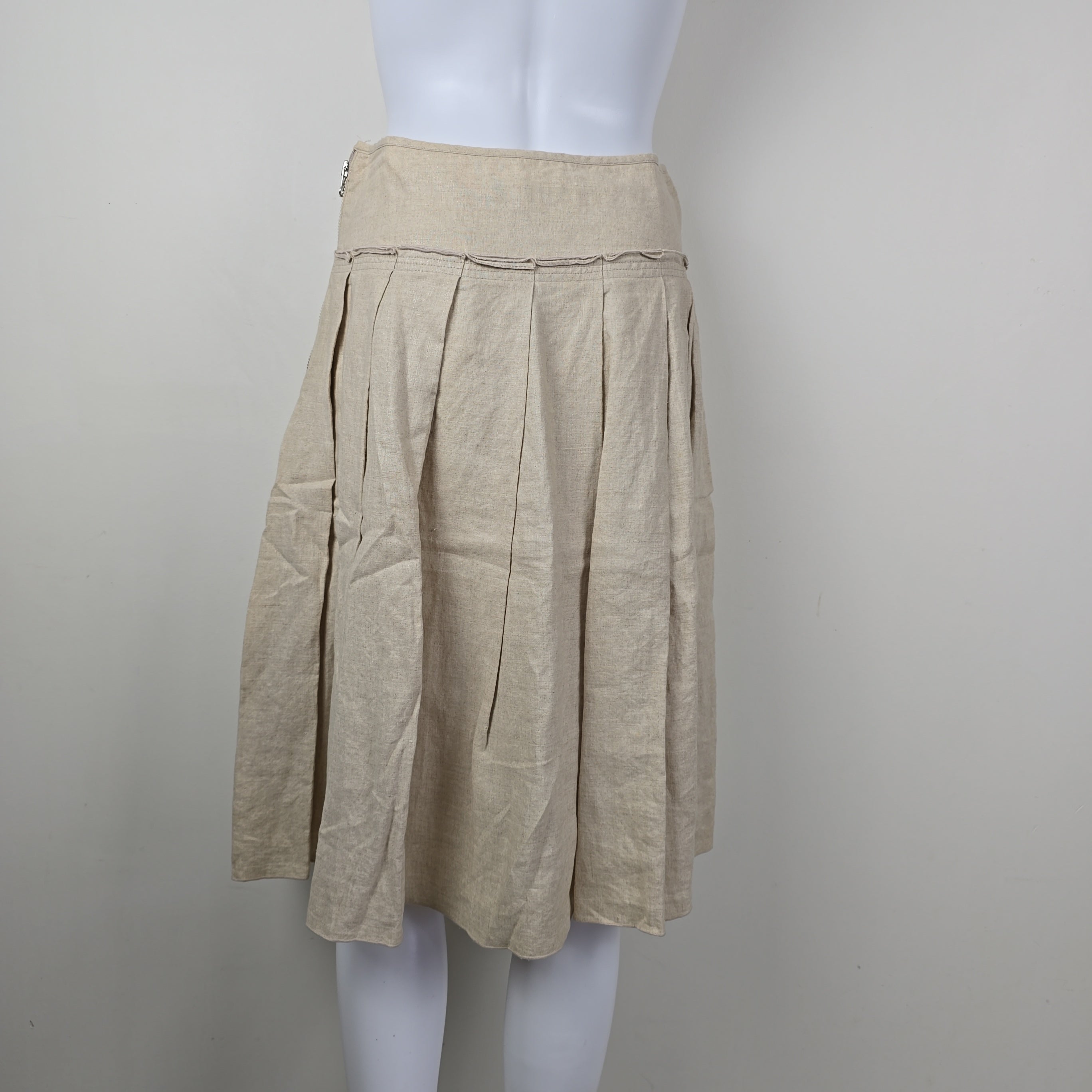 Stack of beige skirt on a white background