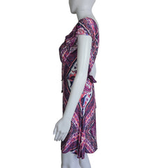 Mannequin wearing a patterned dress on a plain background