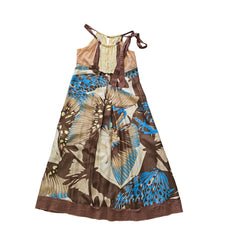 Butterfly patterned dress on a tiled floor