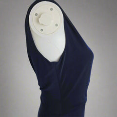Navy blue dress on a light gray background