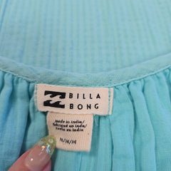 Close-up of a Billabong label on a turquoise fabric