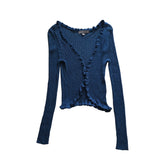 Blue knitted sweater on a light background