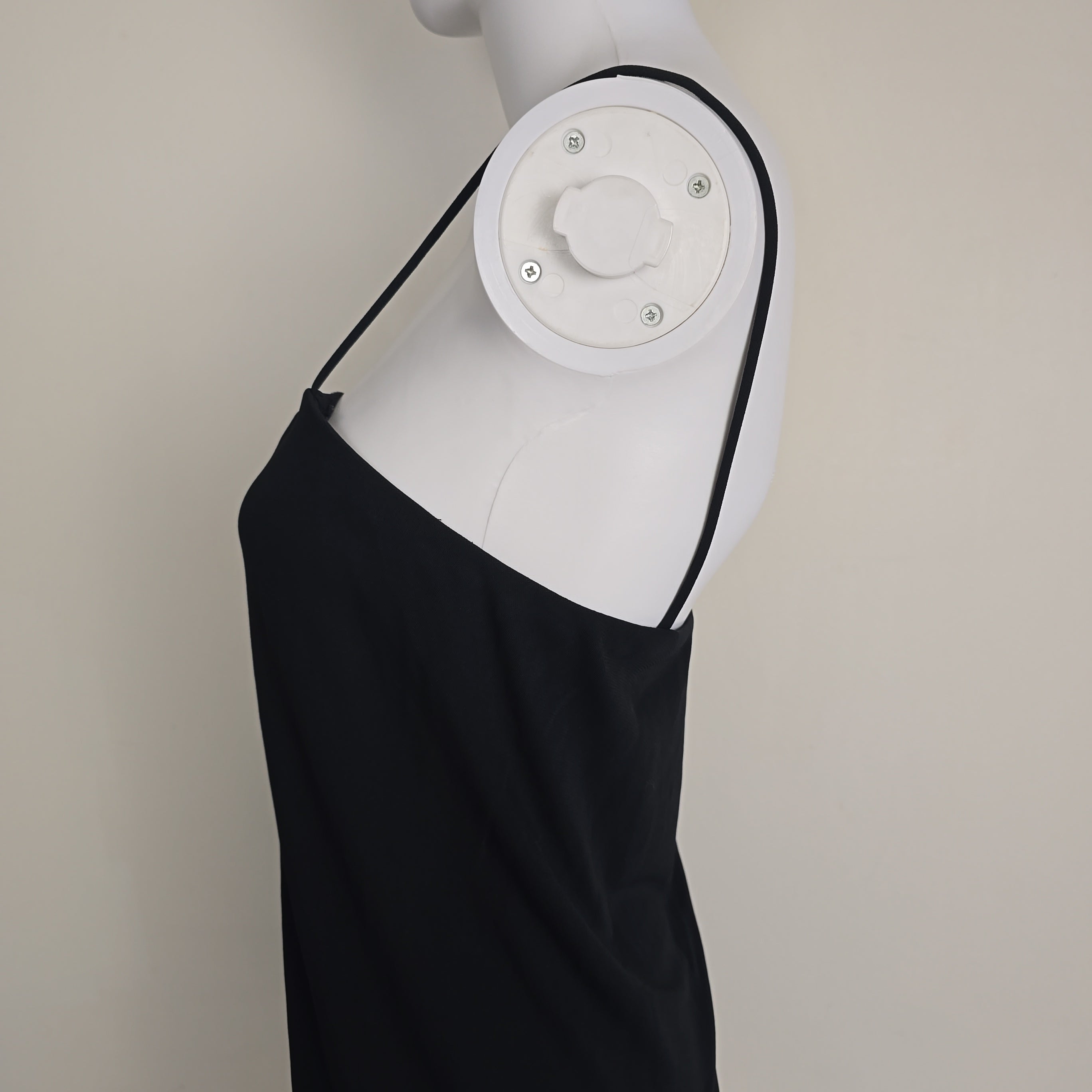 Black mini dress on a light background