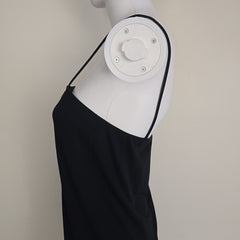 Black mini dress on a light background