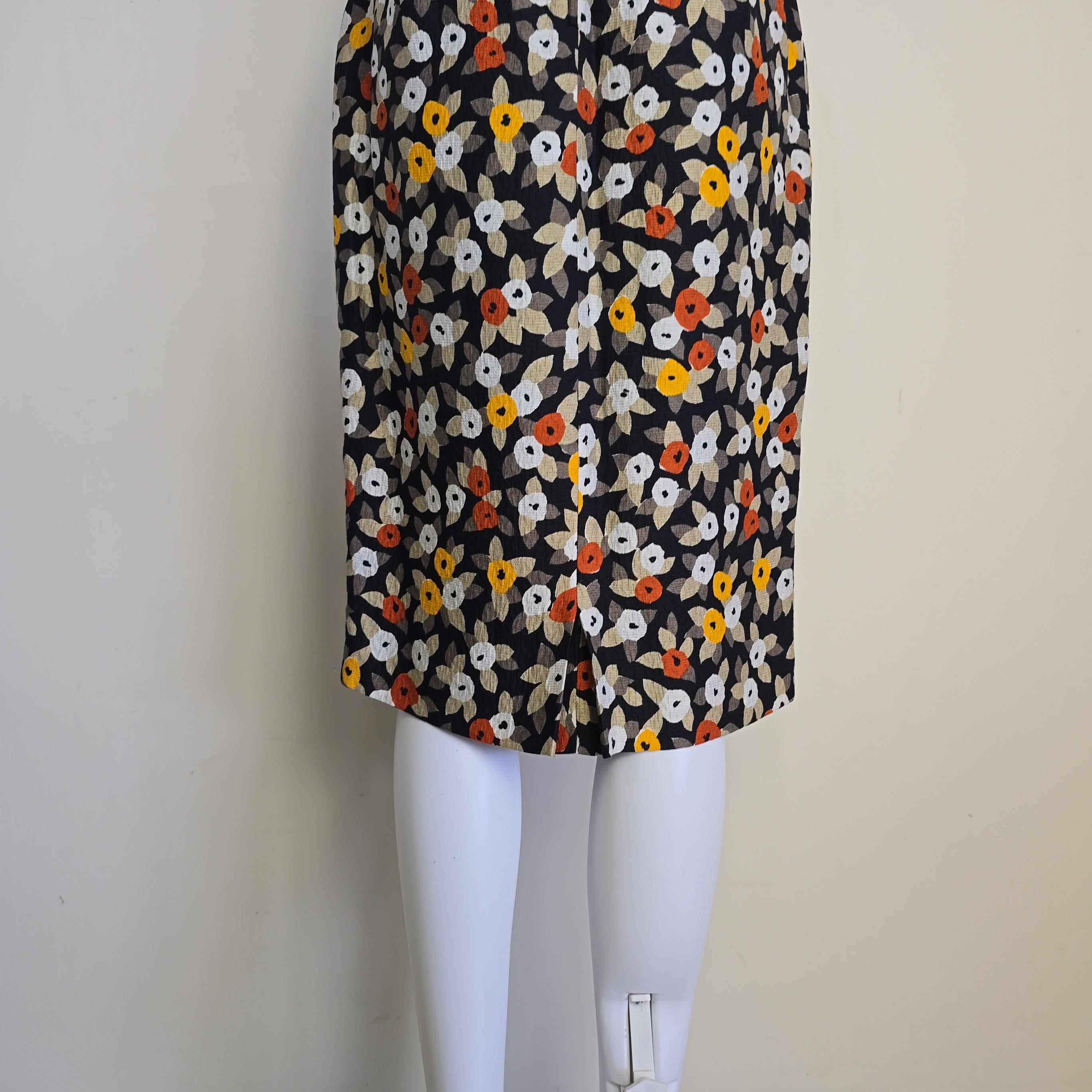 Floral-patterned strapless dress on a light background