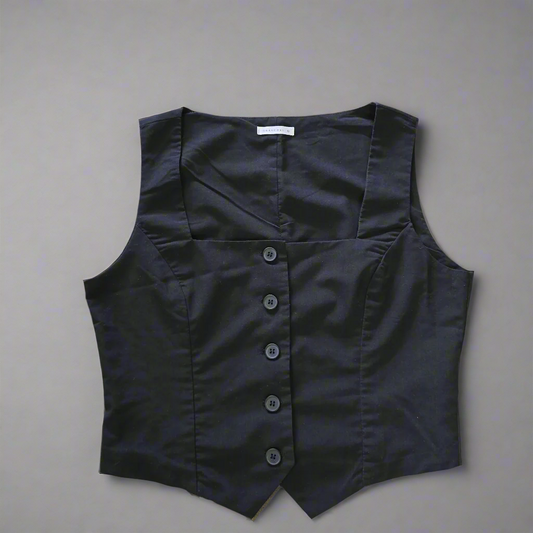 Black vest with buttons on a light gray background 1024