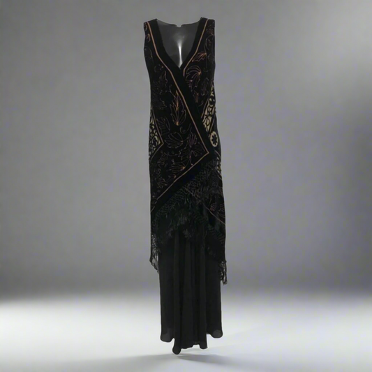 A Lyndia Procanik silk maxi dress featuring an asymmetrical wrap-style design with velvet-like texture and fringe hem. 1024