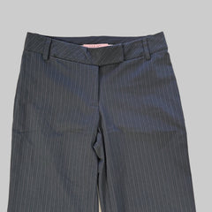 Dark grey striped pants on a tiled floor