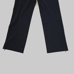 Black leg pants on a tiled floor