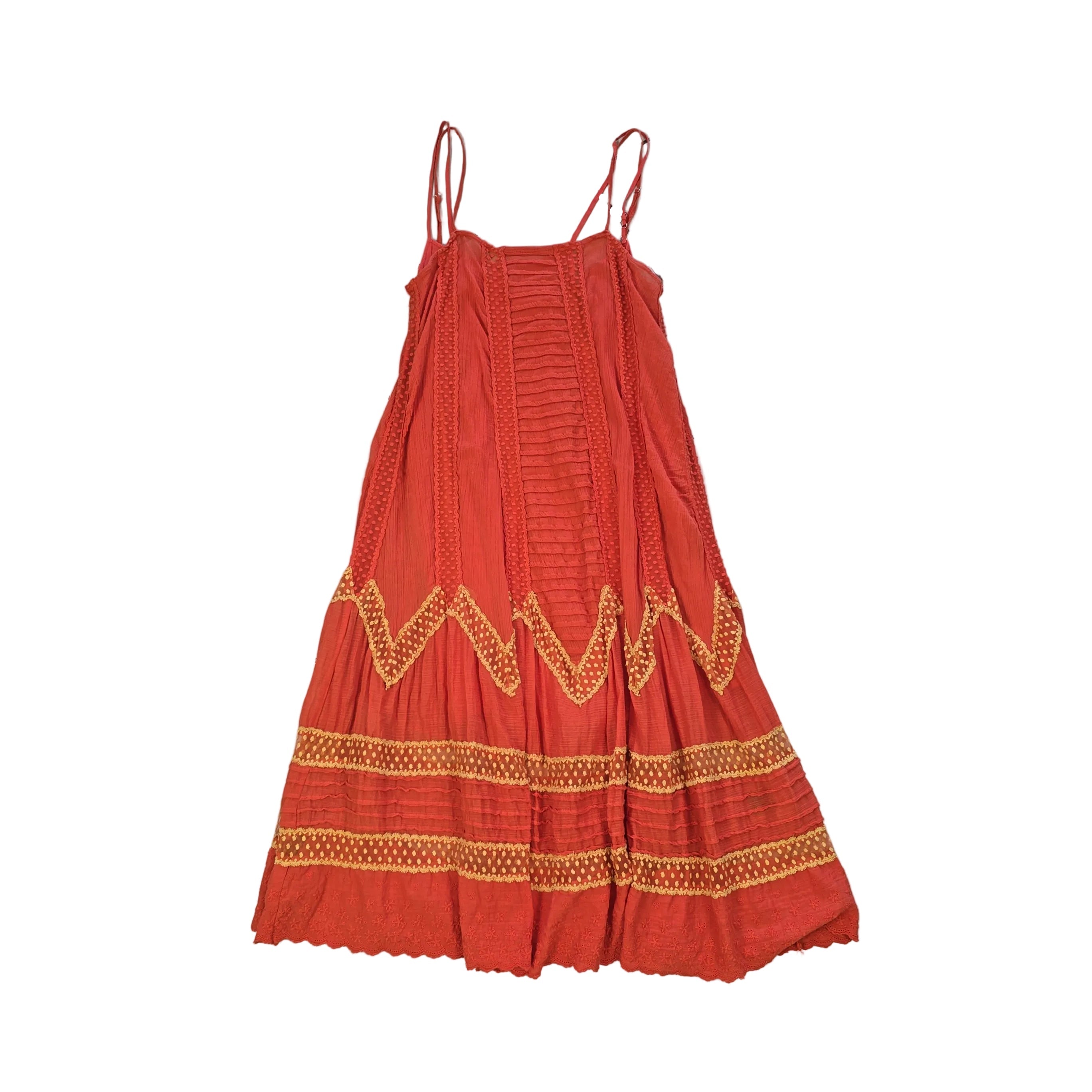 Orange dress with yellow embroidery on a light background