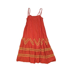 Orange dress with yellow embroidery on a light background