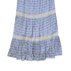 Blue and white patterned dress on a light background