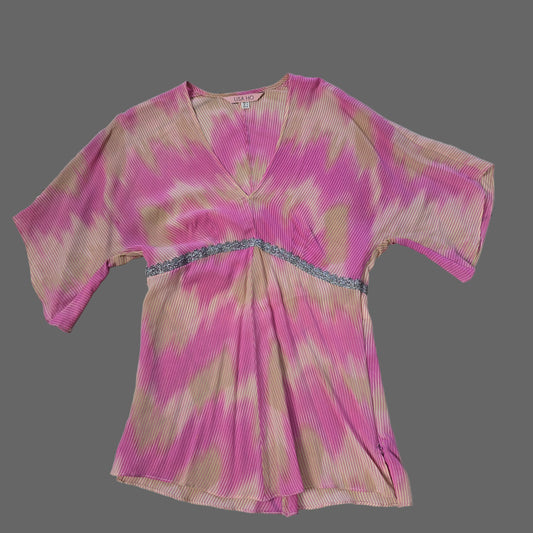 Pink and brown tie-dye top on a tiled floor 2736