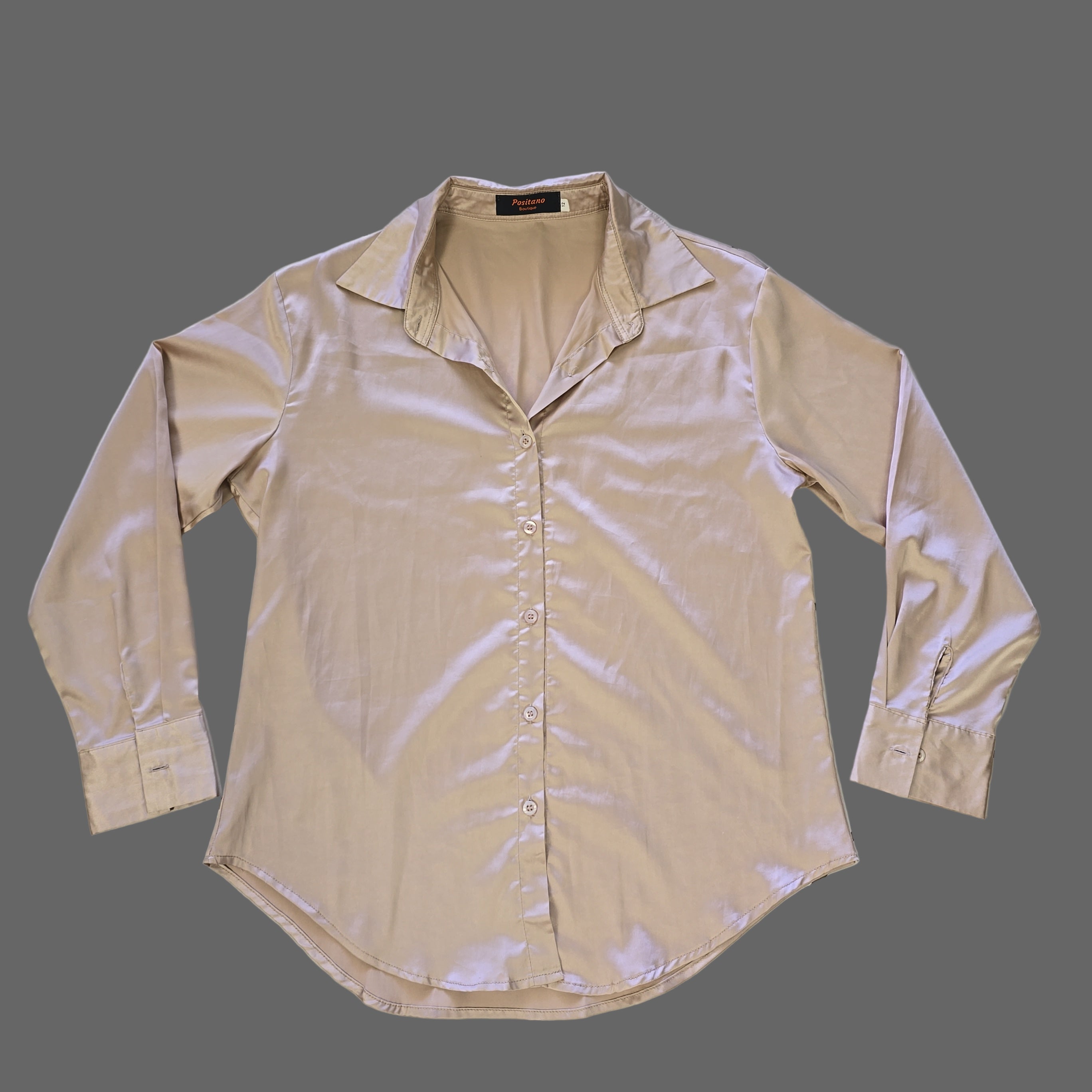 Beige shirt on a tiled floor