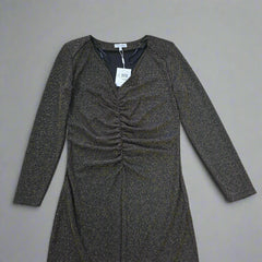 Black and gold textured dress against a light gray background