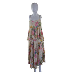 Floral top and skirt on a mannequin against a white wall