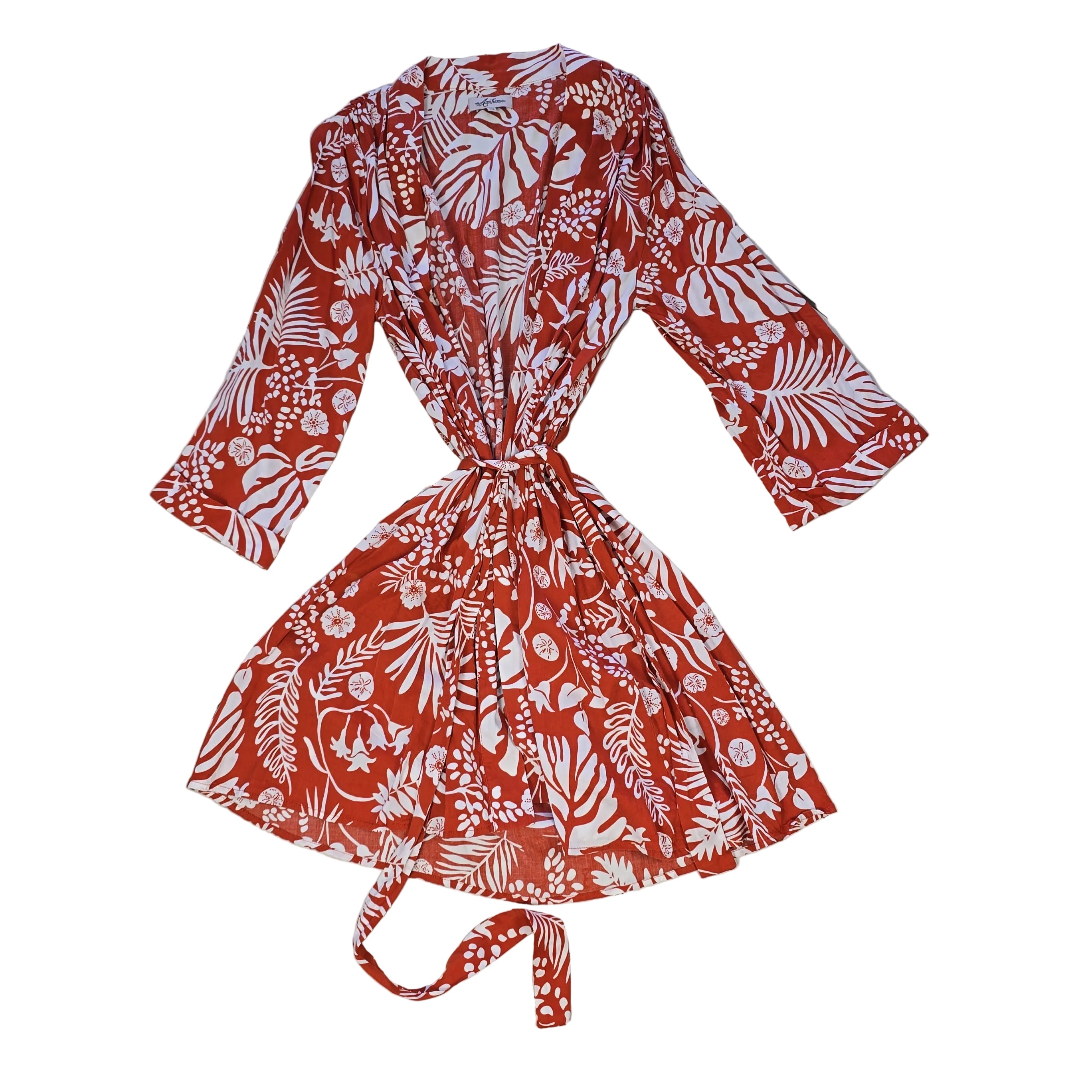 Orange and white palm patterned robe on a light background