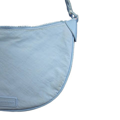 Light blue bag with a visible brand label on a light background