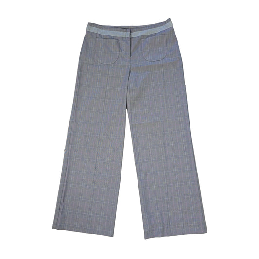 Two pairs of blue checkered pants on a tiled floor 2736