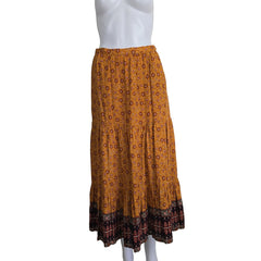 Brown patterned maxi skirt on a light background