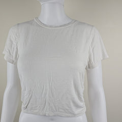 White tank top on a mannequin against a plain background