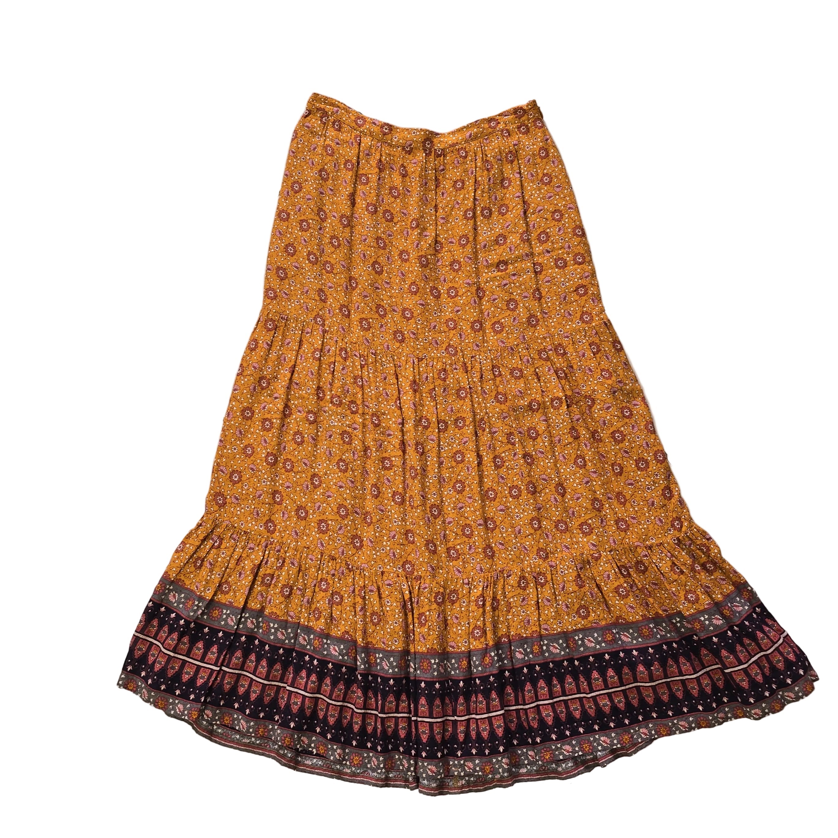 Brown patterned maxi skirt on a light background