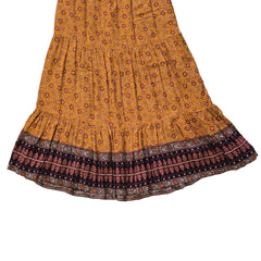 Orange and brown patterned fabric on a light background