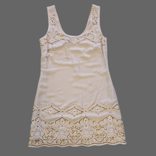 Beige dress on a light background 2736