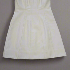 White strapless dress on a tiled floor