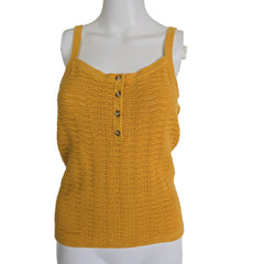 Yellow knitted vest on a mannequin against a beige background