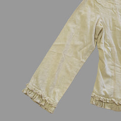 Light yellow jacket with frill details on a light background