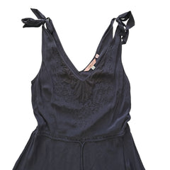 Grey lace dress on a tiled floor