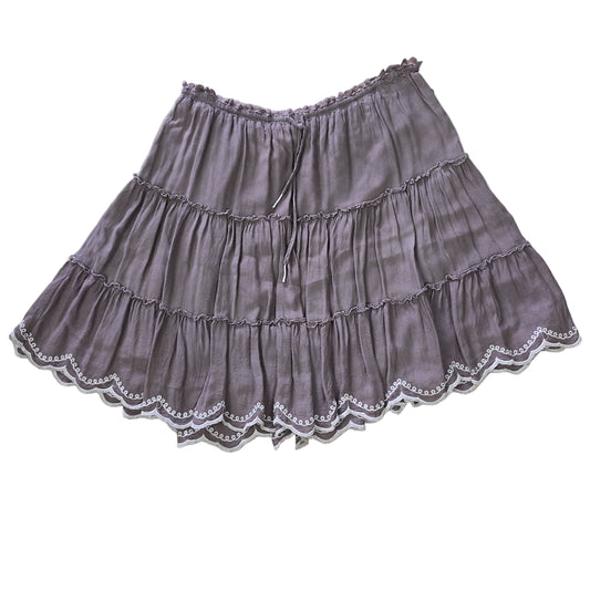 Grey ruffled skirt on a light background 2736