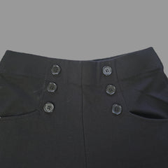 Close-up of black pants with buttons on a light background
