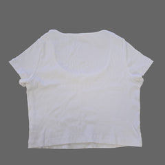 White t-shirt on a tiled floor